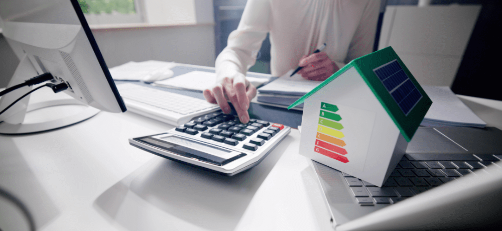 Image of a person using a calculator to price energy.