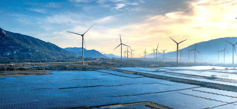 Image of a landscape with wind turbines and solar panels