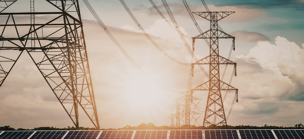Header image of solar cells and power lines